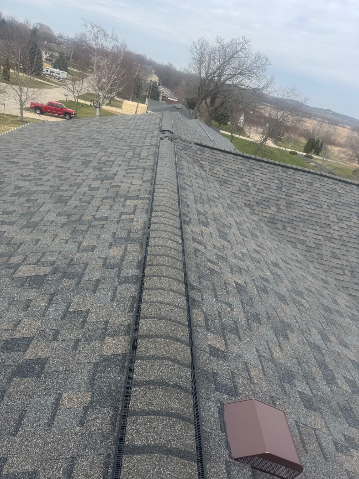 Ridge vent detail on newly installed asphalt shingle roof